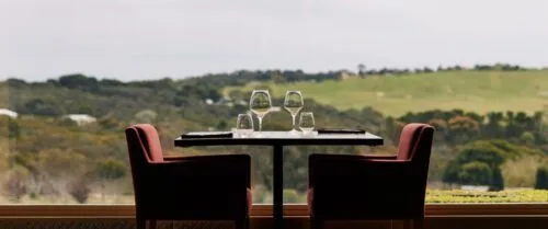 Dining setting looking out over winery and vineyard